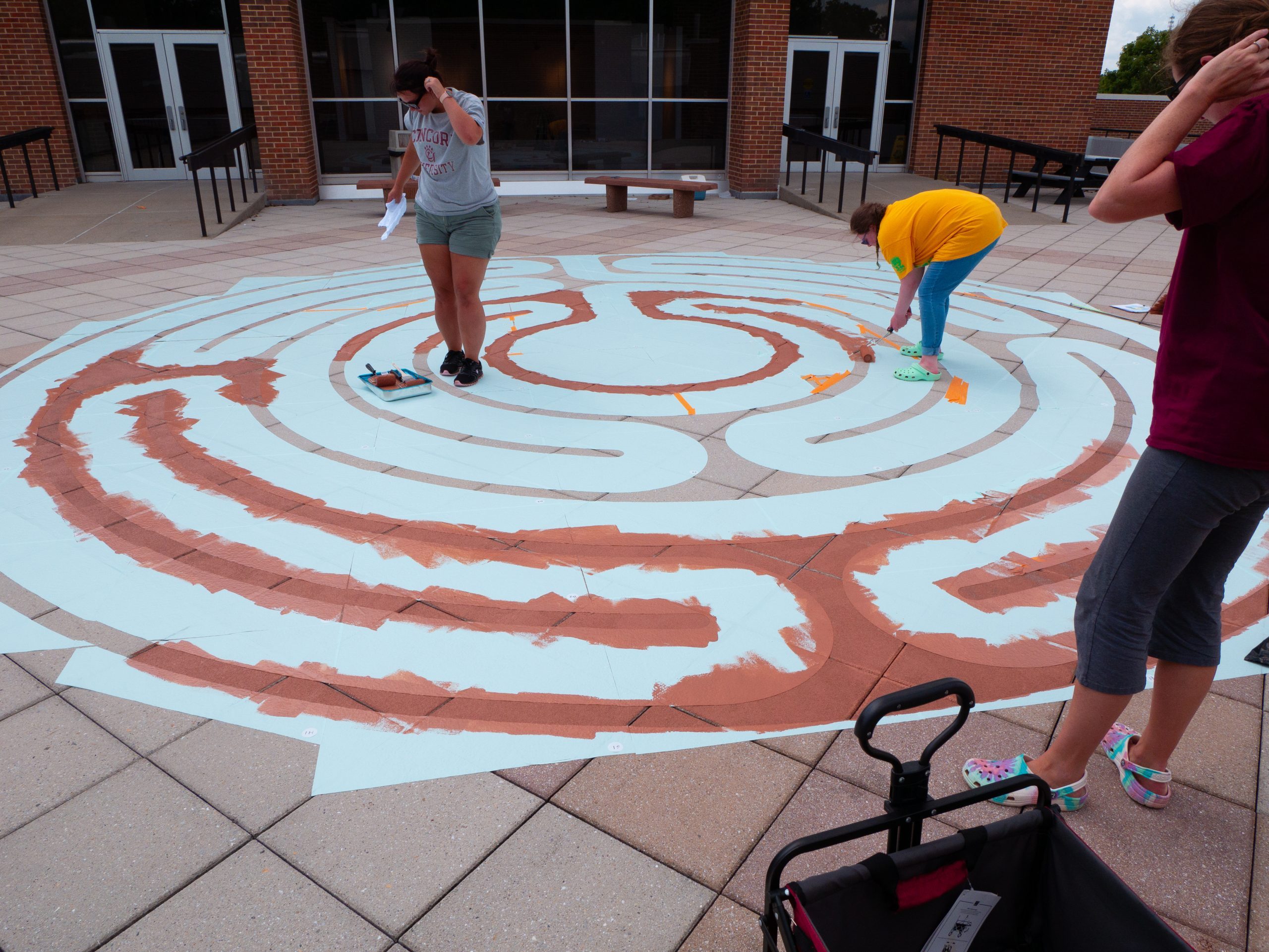 Concord University staff and students painting the labyrinth