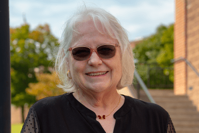 Dr. Cynthia Khanlarian, Ph.D., CPA, CMA pictured outside of University Point at Concord University