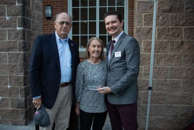 Golden Alumnus 2023, Glenn ’66 & Sandra ’68 Lowe pictured with Blake Farmer, Director of Alumni and Donor Relations