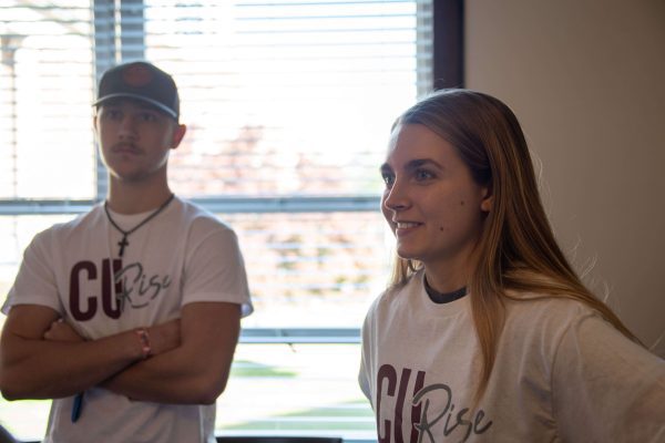 Two CU Rise students talking