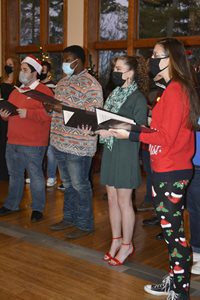 The collegiate singers performing at their holiday concert