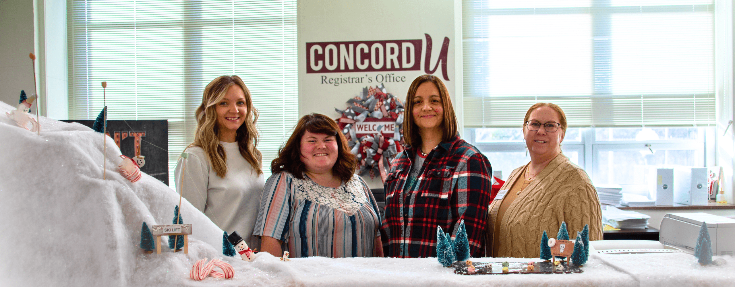 Emily Miller, Brianna Lipscomb, Lucinda Gonderman, and Sheilah Sites pictured behind the Concord University Registrar's Office front desk