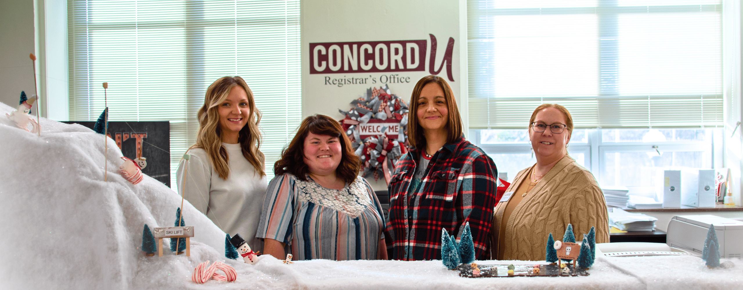 Registrar's Office staff pictured behind the Concord University Registrar's Office front desk