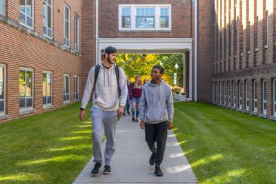 Two students walking around Concord University's campus