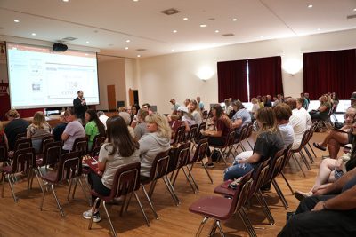 Allen Smith speaking to a large group of people at one of Concord University's Orientation sessions