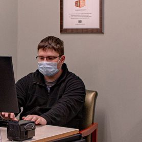 A student using a computer in the veterans office