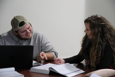 CK4A06311 Two Business Administration students working on homework together