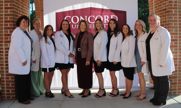 Concord University nursing faculty and students wearing their white coats