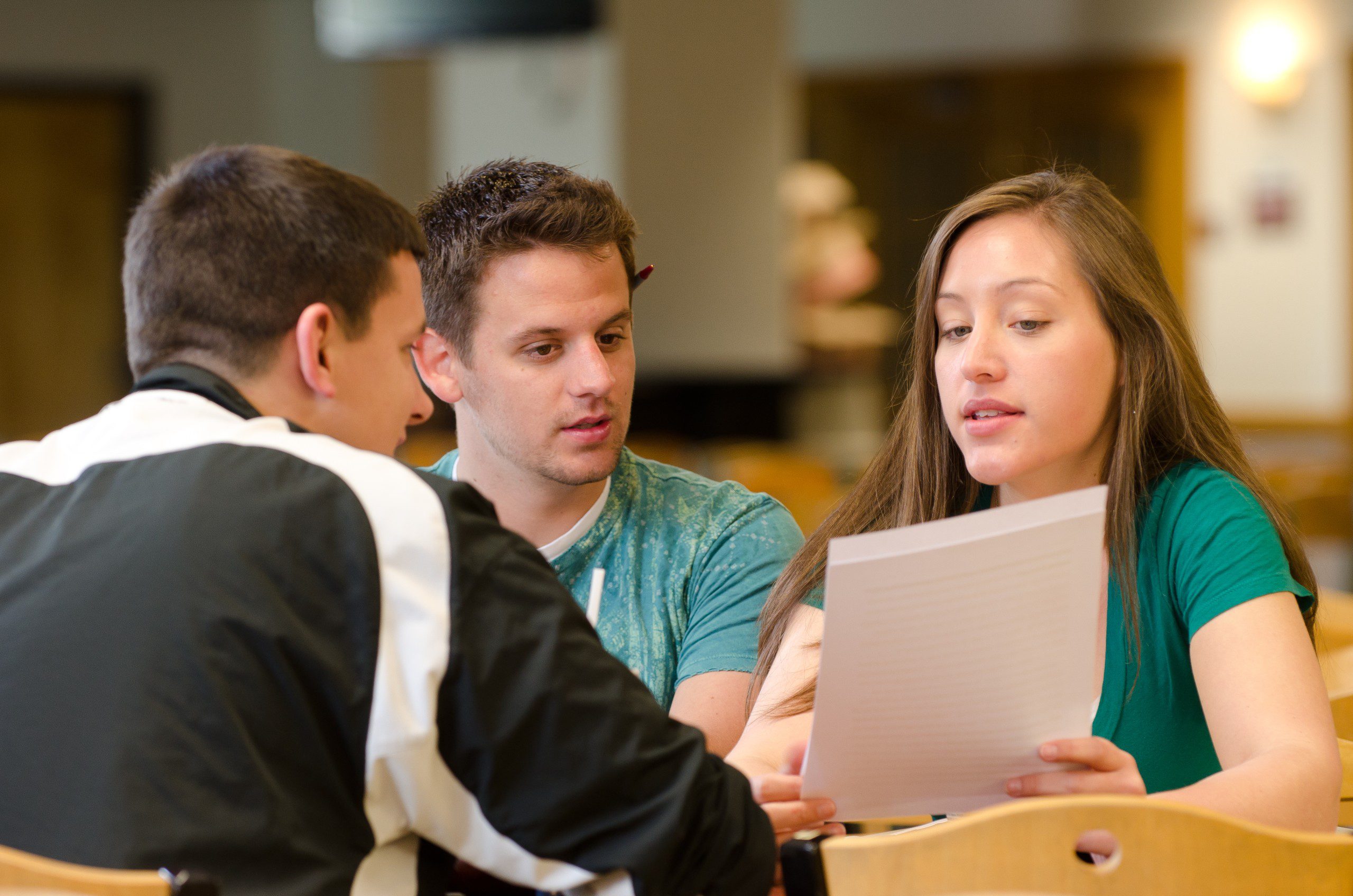 Three students studying in the student center