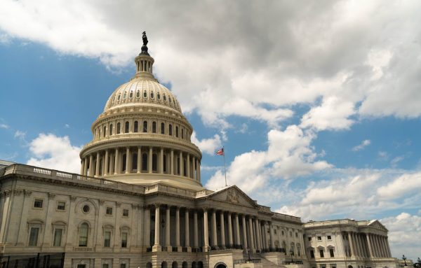 A photo of the United States capitol building under a cloudy blue sky in Washington D.C. taken by Thomas Lin