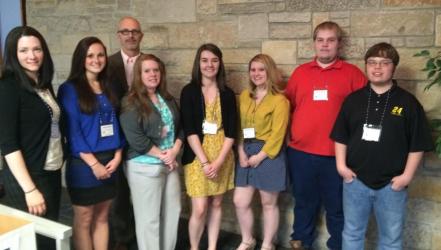 A group of Concord University McNair Scholars Program students standing with Dr. Rodney Klein at a research festival