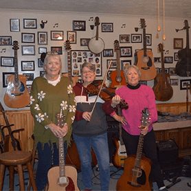 320 The all-woman bluegrass band, West by Goddess. Comprised of Susan Spearen, Linda Petry, and Becky Whitt from Fayette County, West Virginia.