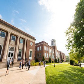 Students walking outside of the library at Concord University