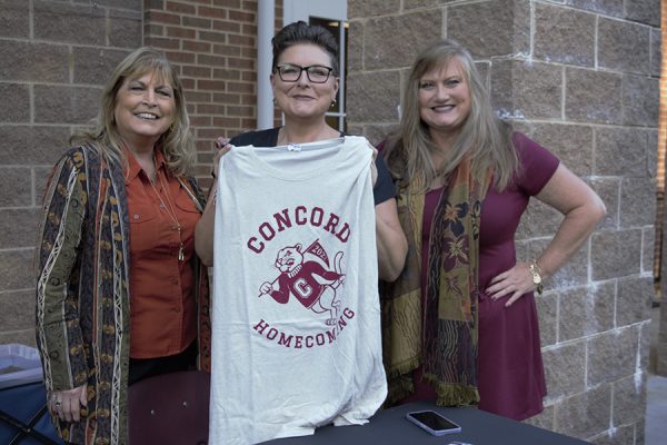 Members of the CUAA display the 2023 limited edition Concord University Homecoming t-shirt.