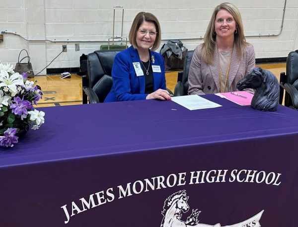 Dr. Kendra Boggess, President of Concord University and Dr. Joetta Basile, Superintendent of Monroe County Schools signing the agreement for the Level-Up Program for high school juniors and seniors interested in pursuing degrees in Cybersecurity, Education, Nursing, or Social Work.