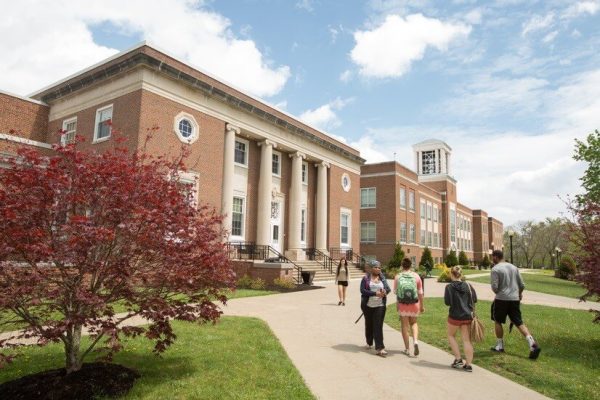 Students walking towards the library on Concord University's campus