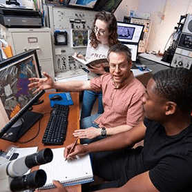 Dr. Stephen Kuehn with two students inside of Concord University's Materials and Rare Earth Element Analysis Center