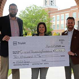 Patrick O'Malley, Regional President, Sarah Turner, VP of Advancement, and Jordan Woodbridge, Market President