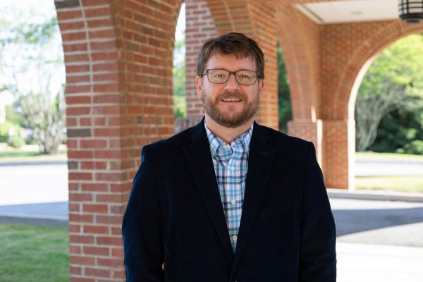 A photo of Concord University Assistant Professor of Theatre Logan Regan outside of University Point