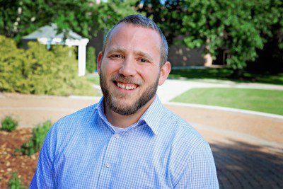 A photo of Scott Inghram in front of a gazebo on Concord University's campus