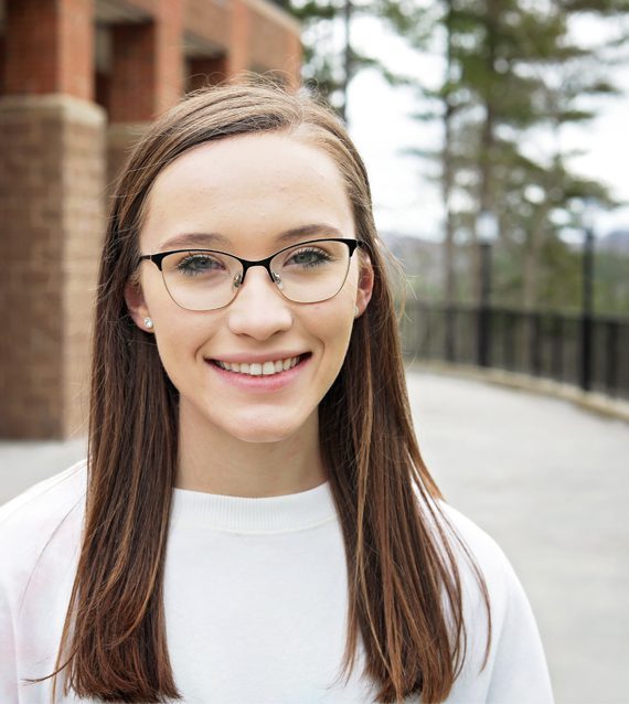 A photo of Hannah Justice in front of University Point