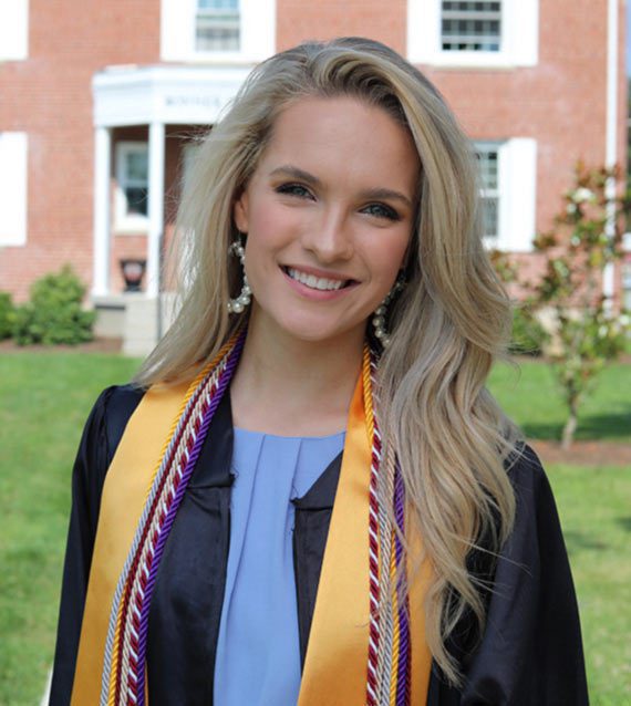 A photo of Kelsey Walls in front of the Concord University Bonner House