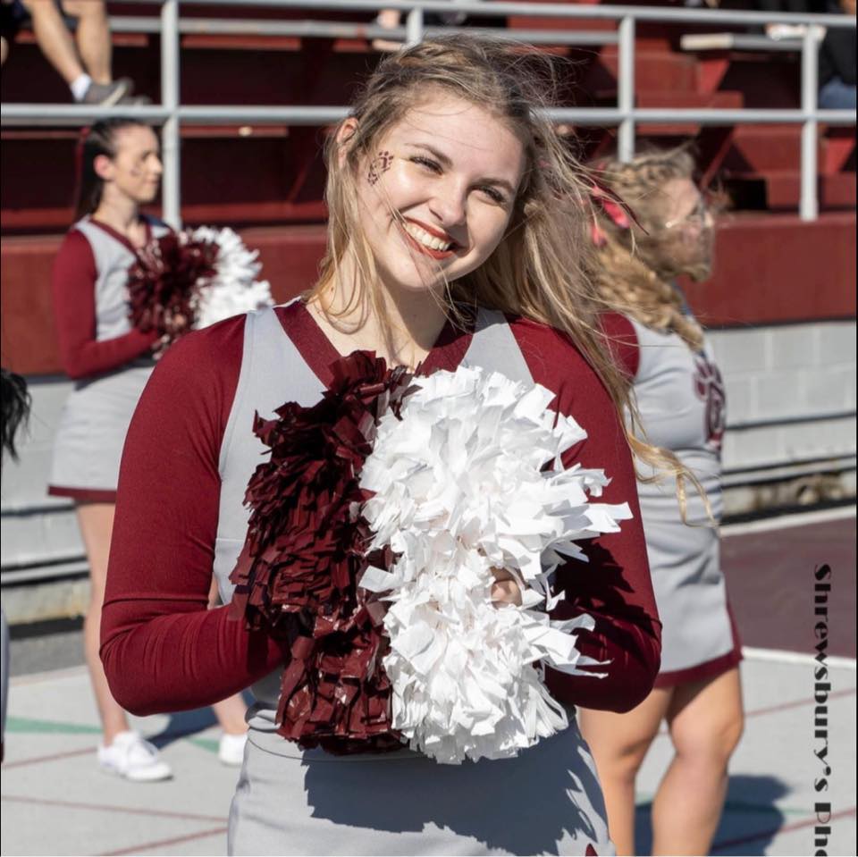 Concord University student Madison Dye wearing her cheerleading uniform at a CU Football game
