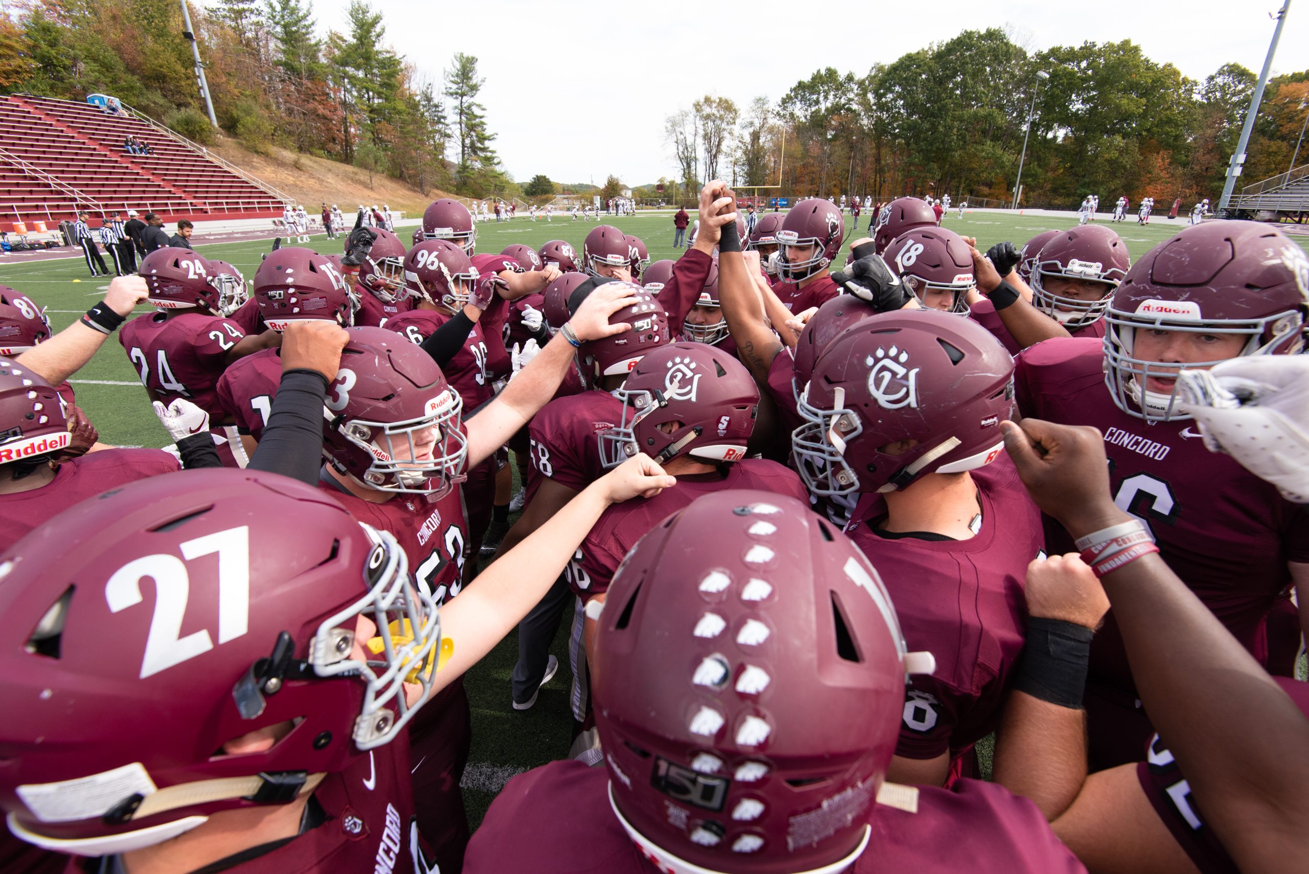 Football players in a huddle