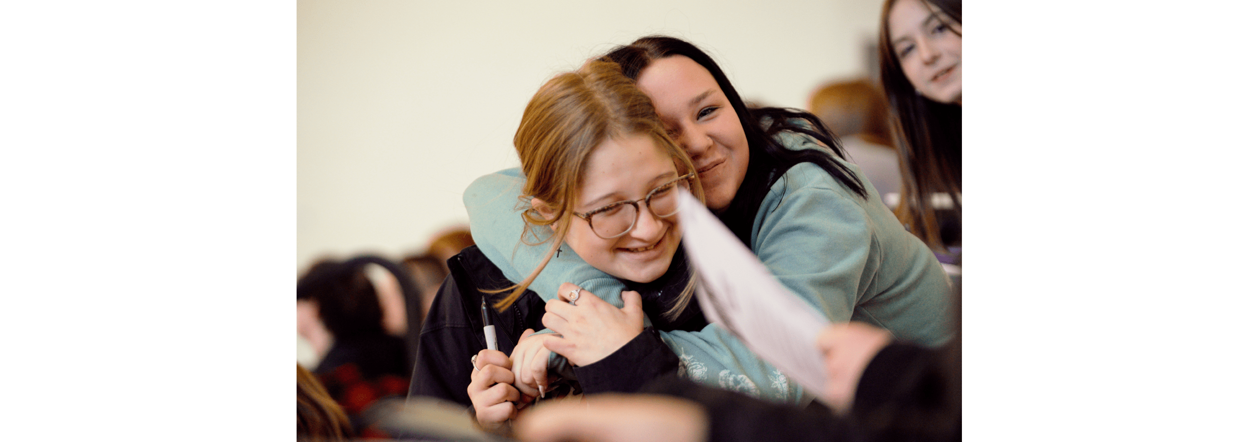 Students at PikeView Middle School share a hug during the Student Success Agency kickoff event in Fall 2023.
