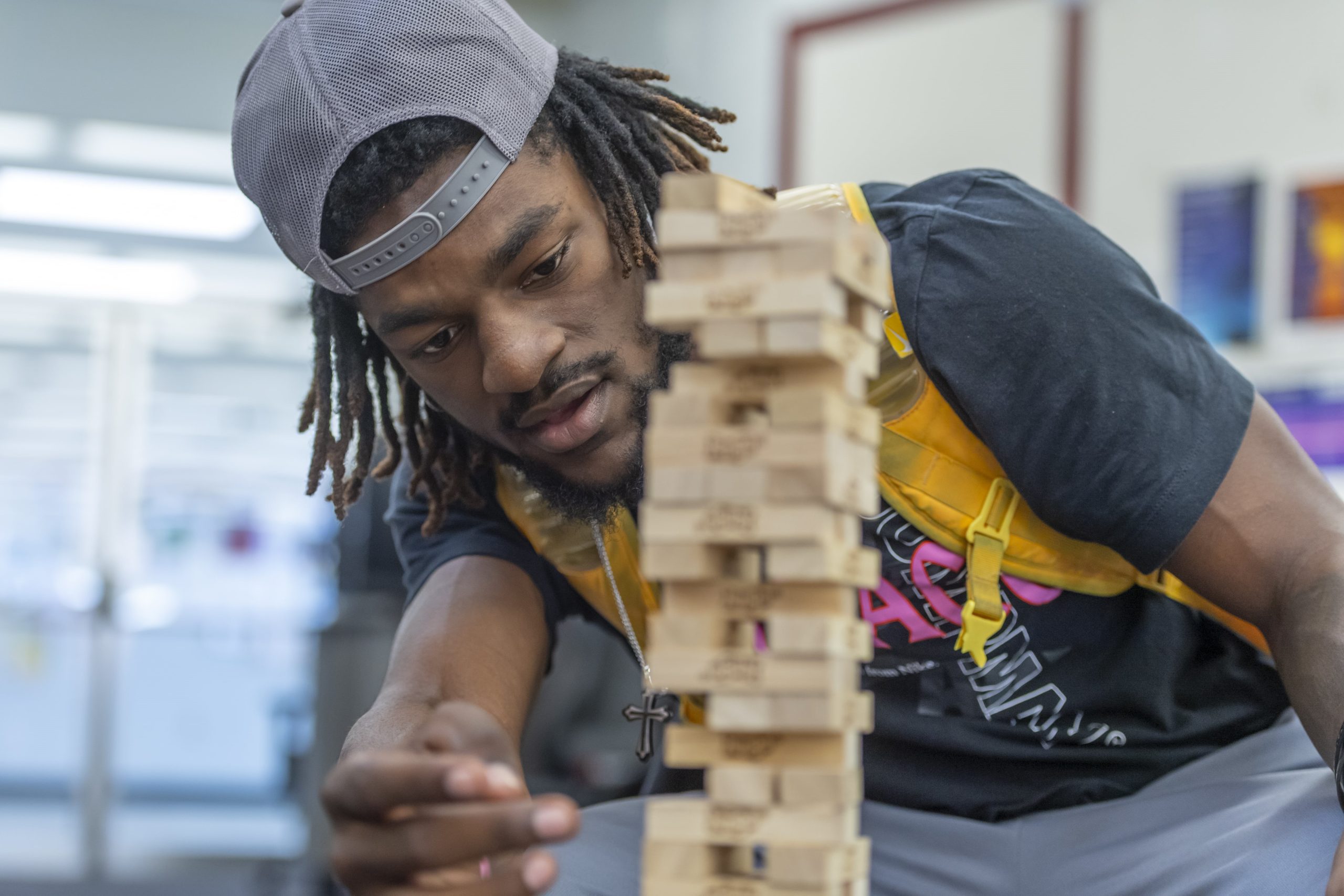 A student playing Jenga in Concord University's Game Room