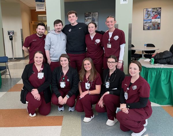 Group of BSN students pose together at an interdisciplinary event promoting teamwork in healthcare professions.