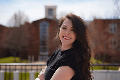 Jenna Stowers in front of the Bell Tower.
