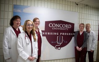 Members of the Nursing Department stand together in front of a wall mural in the Health Sciences hallway depicting the Nursing Program logo. Members include (from left to right) Dr. Martha Snider, Professor Amanda Nichols, Dr. Michele Holt, Krystle Land, and Professor Danita Farley.