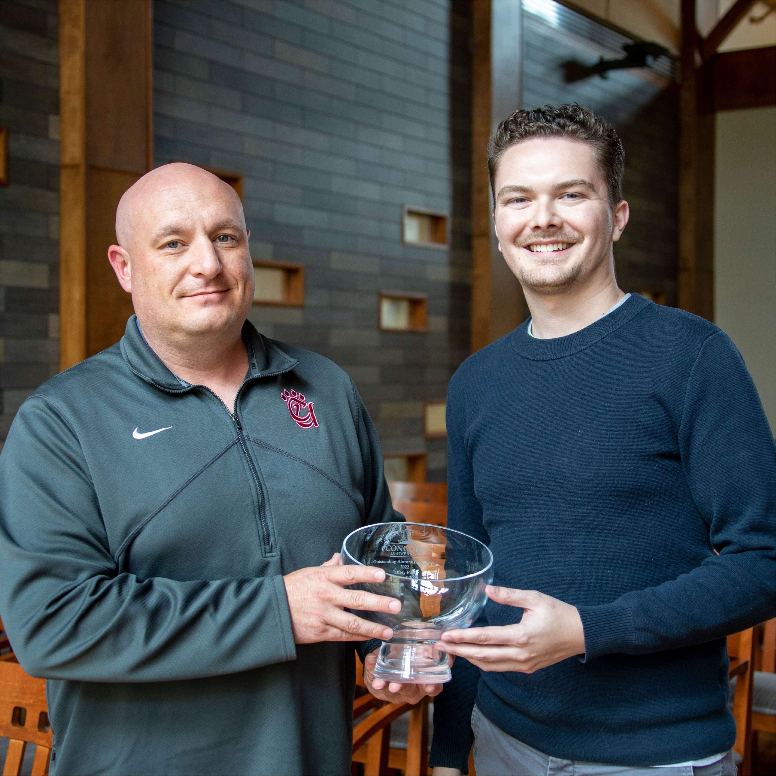 Jeffrey Pack receiving his CUAA award from Blake Farmer