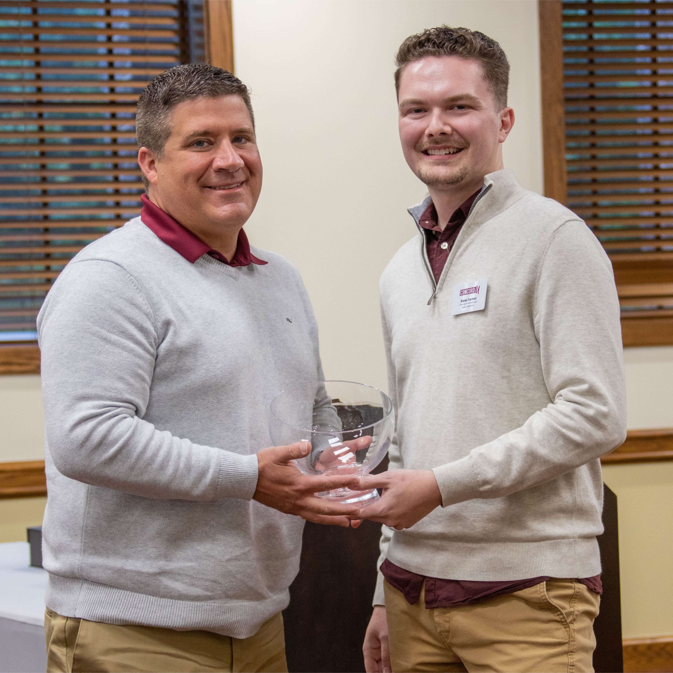 Dr. Brad Lane receiving his CUAA award from Blake Farmer