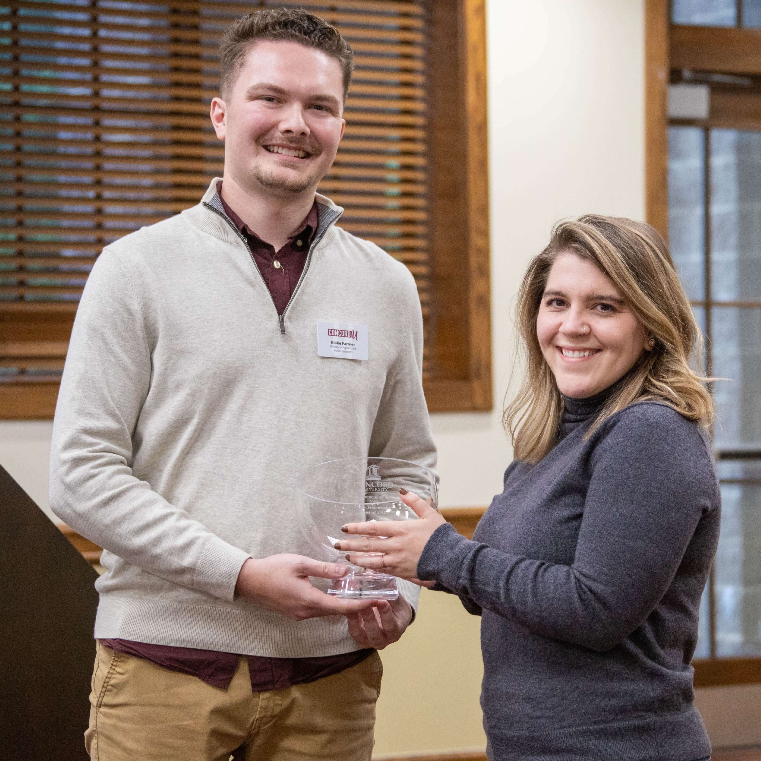 Emily Fridenmaker receiving her CUAA award from Blake Farmer