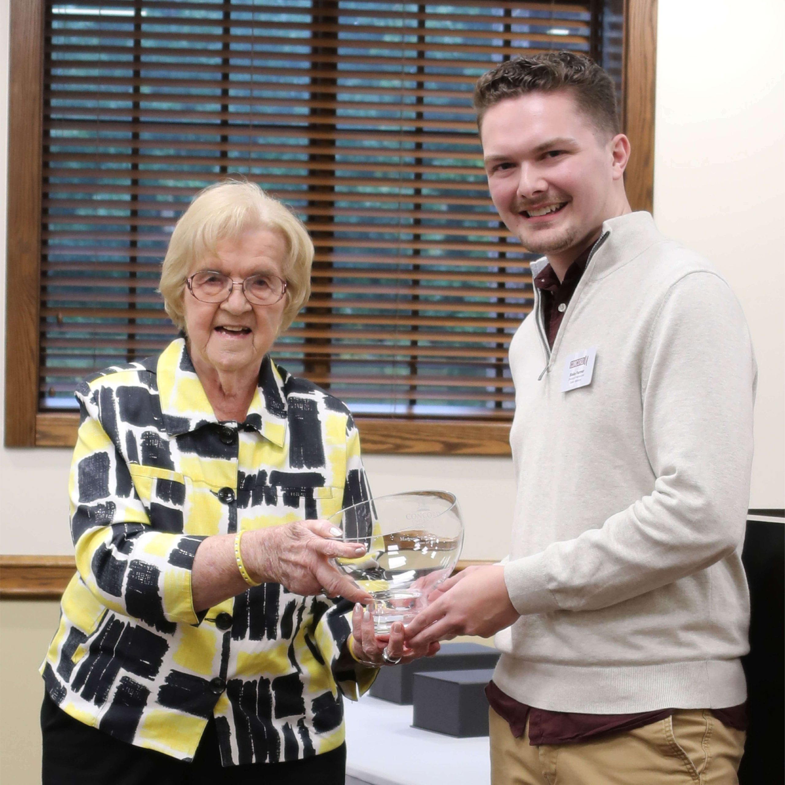Margaret “Peggy” Edmunds receiving her CUAA award from Blake Farmer