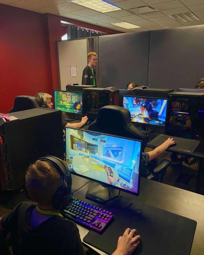 A group of Esport Campers playing Fortnite in Concord University's Esports facilities