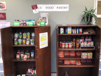 Two of the shelves in Concord University's food pantry full of canned goods and other foods