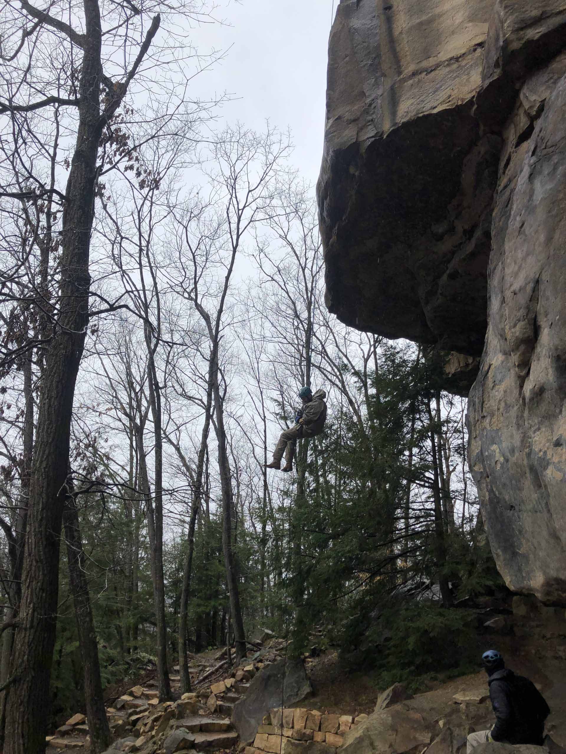 A student rock climbing