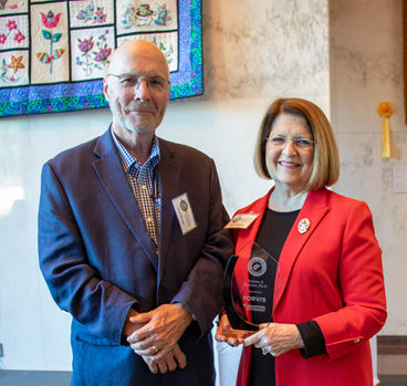 download thumbnail David Barnette, Chairman of Concord University’s Board of Governors, with President Dr. Kendra Boggess. President Boggess has been inducted into West Virginia Executive magazine’s Sharp Shooters Class of 2023.